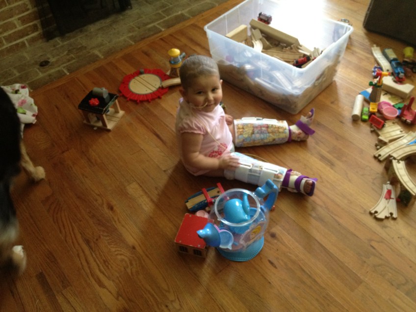 Phoebe plays with her orthotics on.